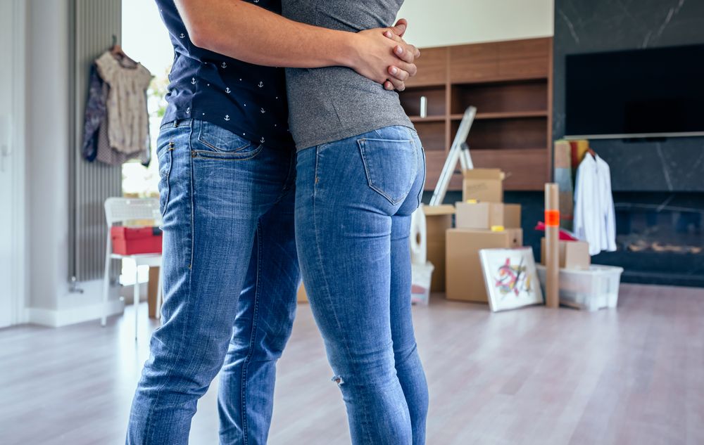 Couple hugging in the living room