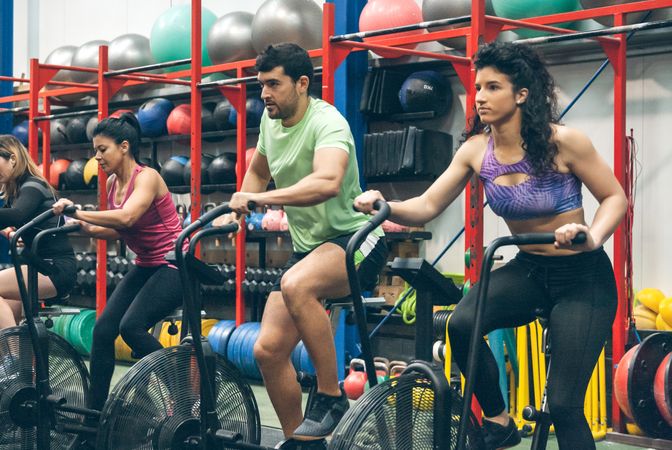 Athletes doing air bike indoor