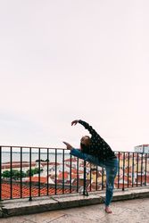 dancer dancing against cityscape
