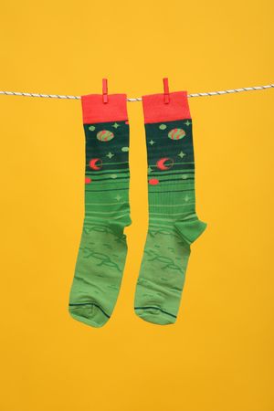 Casual clothes and wearing concept - socks, clothes for foot