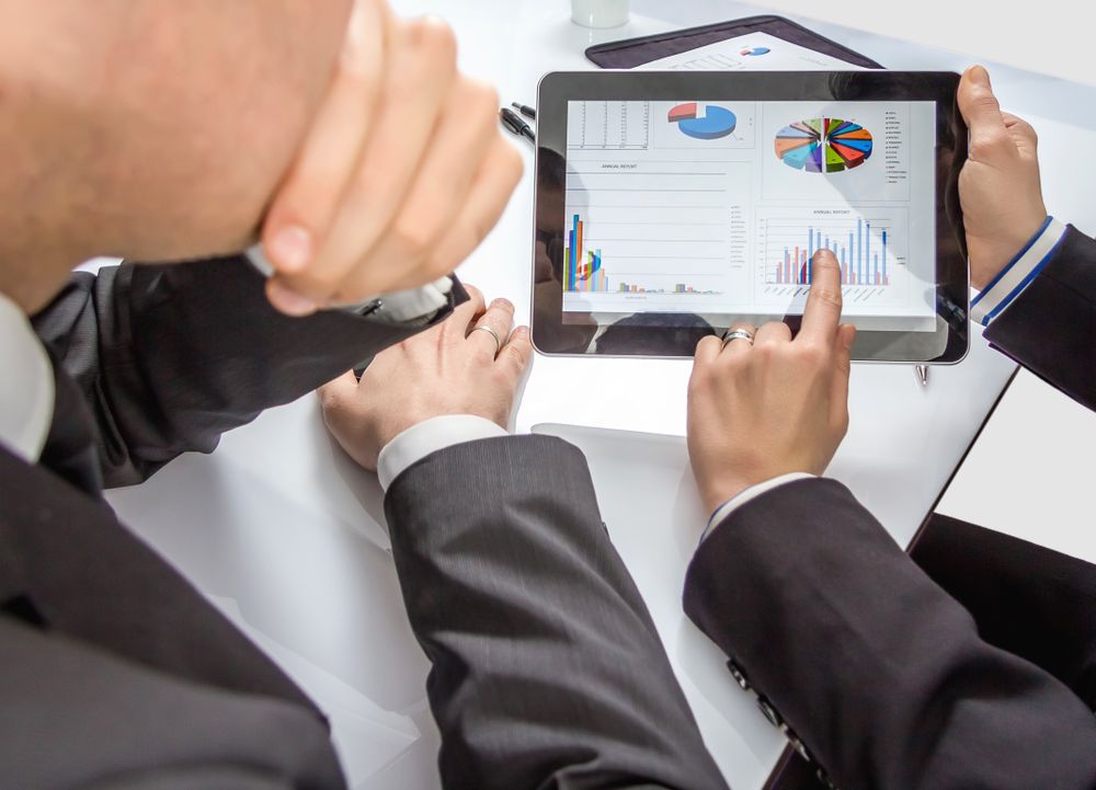 Business people analyzing documents in a meeting