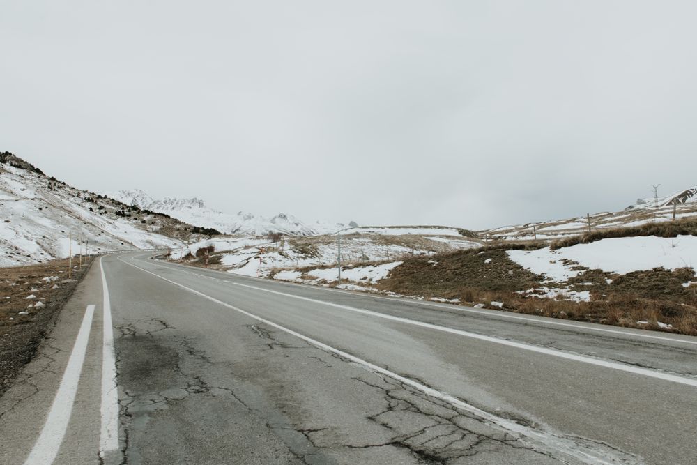 Countryside road between snow hills