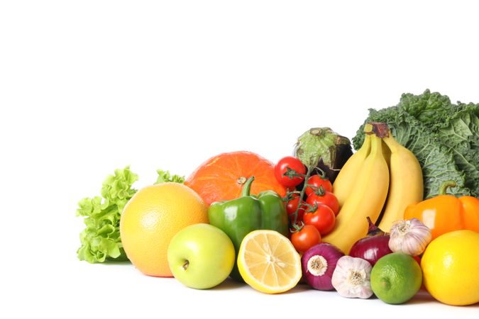 Composition with fresh vegetables and fruits isolated on blank background