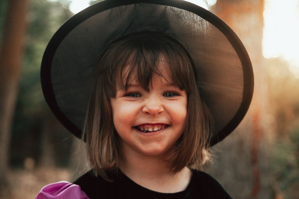 Happy girl in witch costume