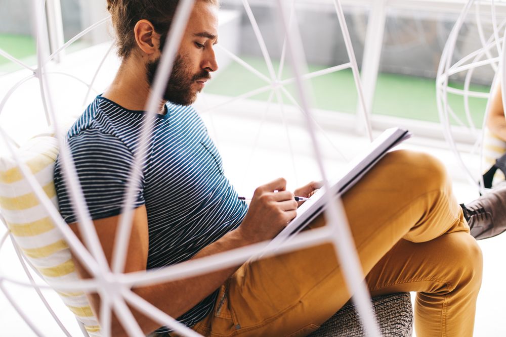 Man writing in a notepad