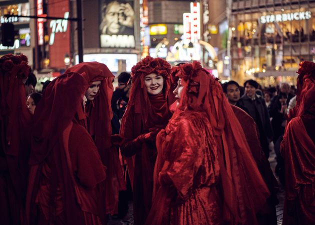 Japan - Tokyo, Shibuya Japan - November 29th, 2019: Red Rebel Brigade talking amongst themselves