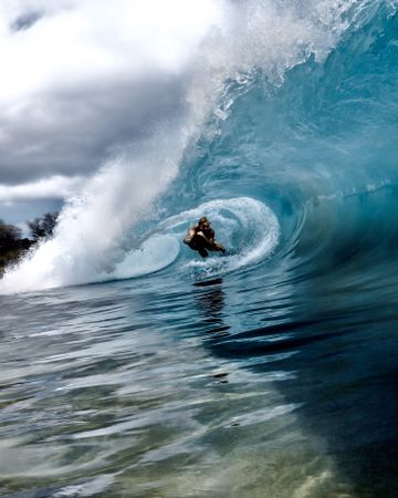 Person surfing sea wave