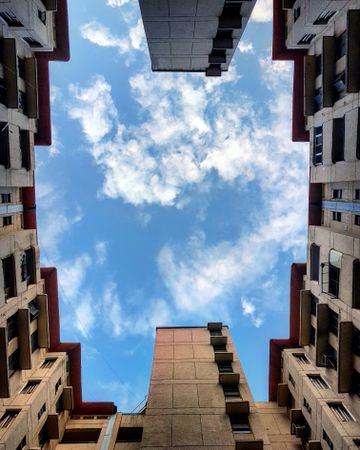 Low angle view of concrete building under blue sky
