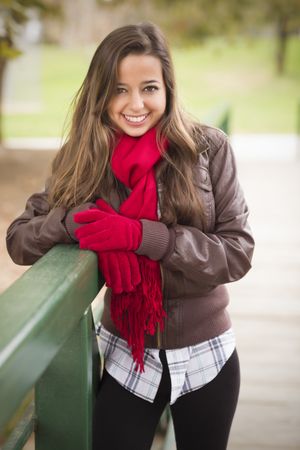 Woman Portrait Wearing Red Scarf and Mittens Outside