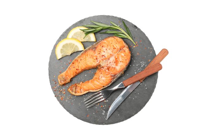 Plate with grilled salmon isolated on blank background