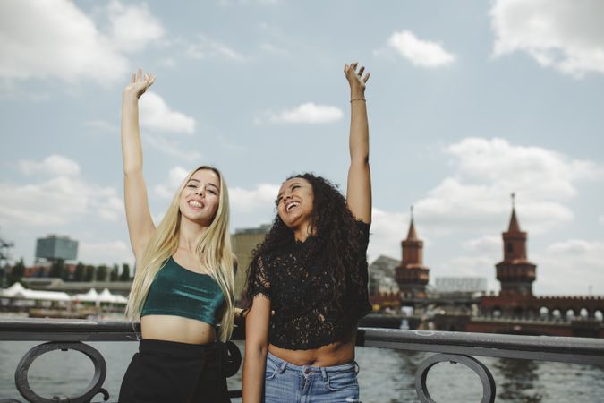 Cheerful friends on city river