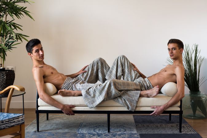 Stylish shirtless gay couple posing