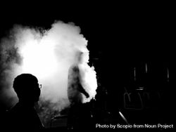 Grayscale photo of two men surrounded by smoke 4Z7Qyb