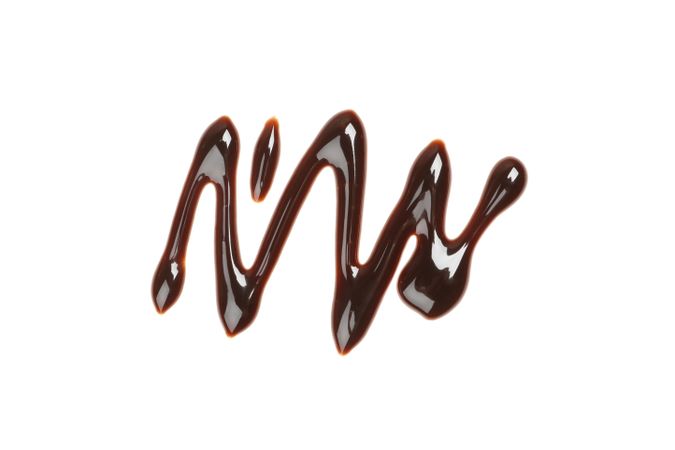 Tasty melted chocolate isolated on blank background