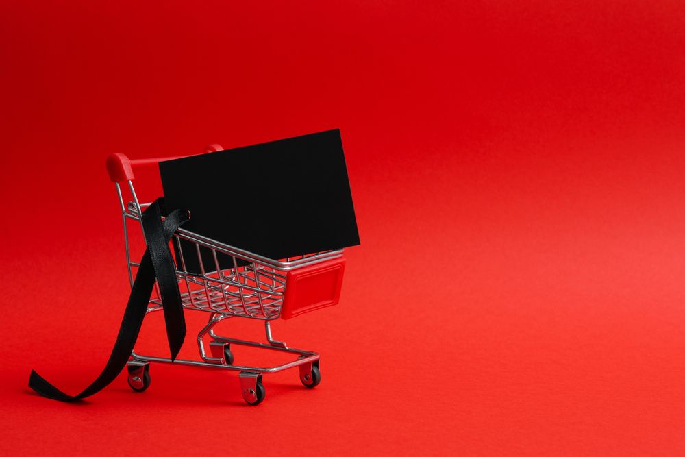 Shop trolley with tag on red background