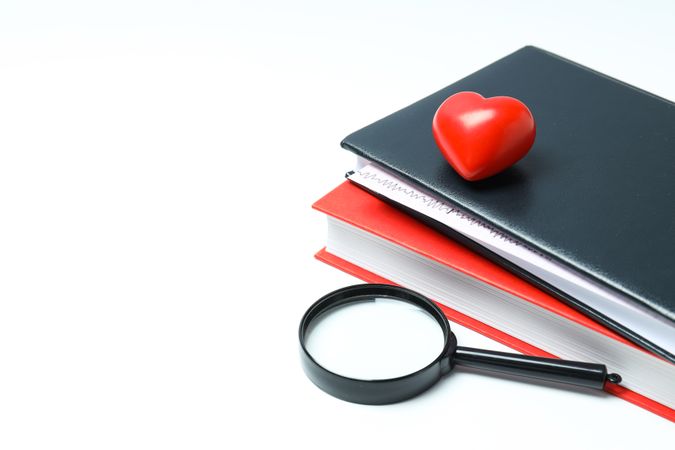 Medical literature - books and doctors accessories on light background