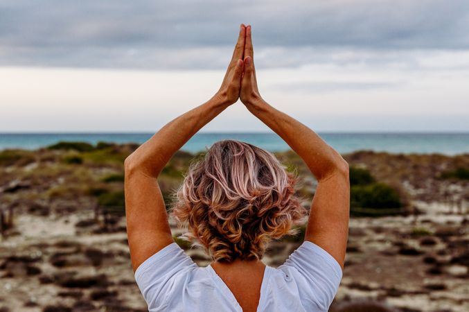 Adult woman practicing martial arts in nature