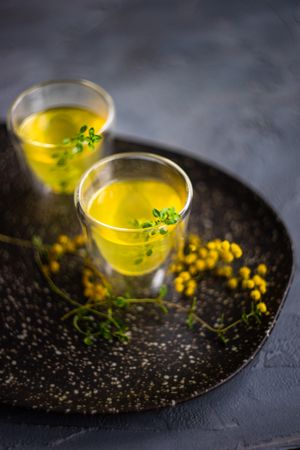 Two glasses of limoncello with garnish