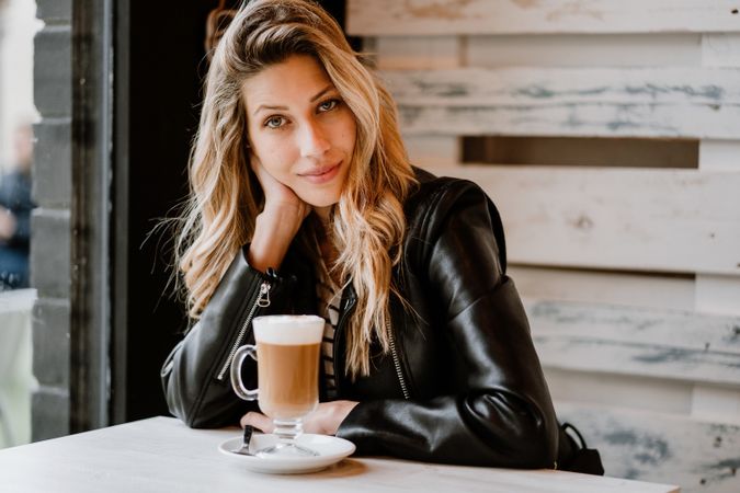 Woman drinking coffee from a glass
