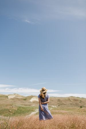 Young woman gathering dried spikes