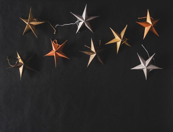 Flat-lay of colorful paper toy decorative stars
