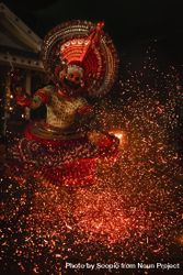 Man performing Theyyam ritual form of dance worship outdoor 47qoO0