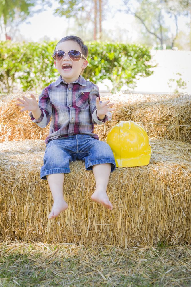 Boy Laughing with Sunglasses and Hard Hat