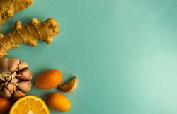 Top view of fresh ingredients on green background for detox drink