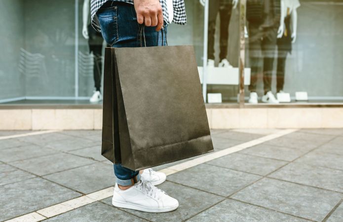 Low section of man shopping