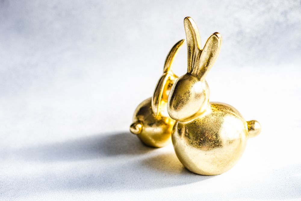 Easter holiday card concept with two ornamental golden figures
