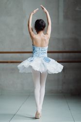 Back view of dancing ballerina in blue tutu 5oya8b