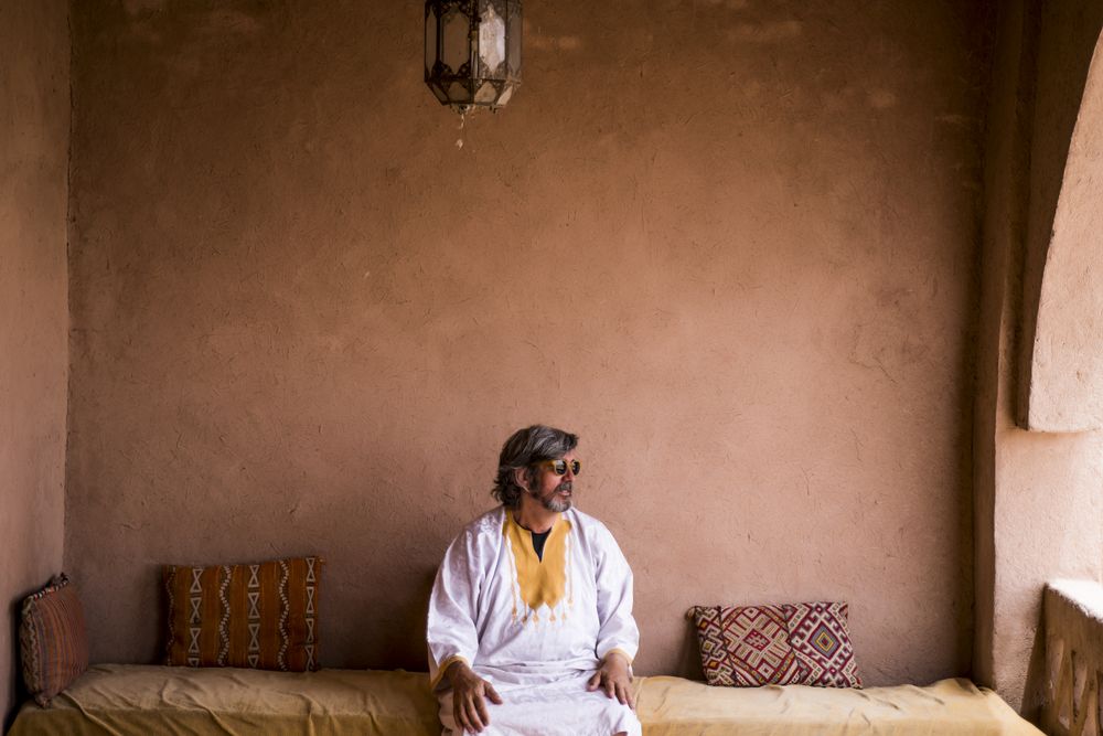 Man sitting on oriental stone terrace