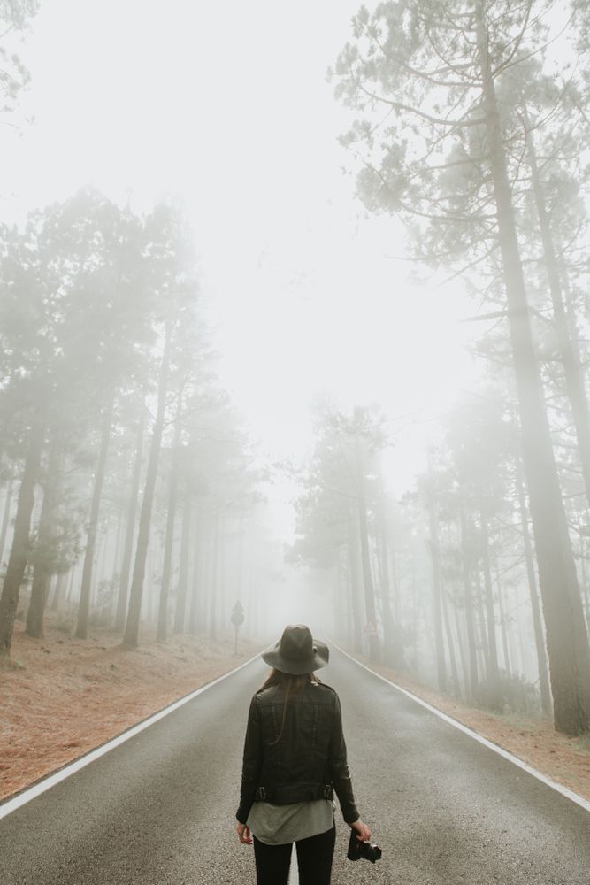 Woman with camera in forest