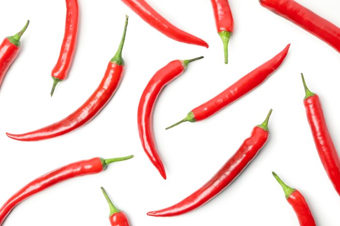 Flat lay with chilli peppers isolated on studio background