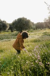 Young girl standing in a field