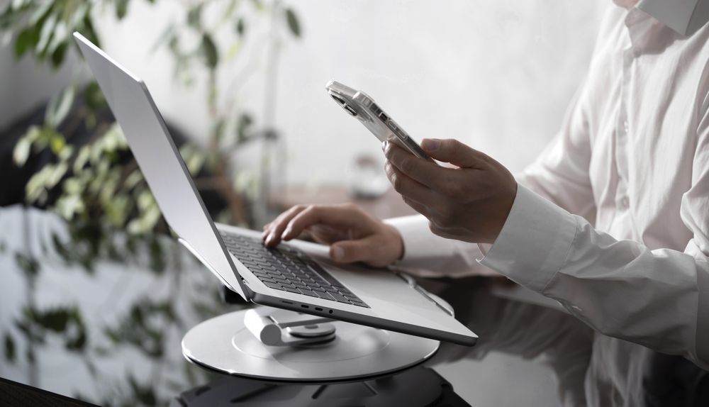 Businessman Working on Laptop at Office Desk