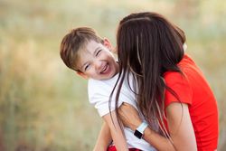 Affectionate mom with son outdoor