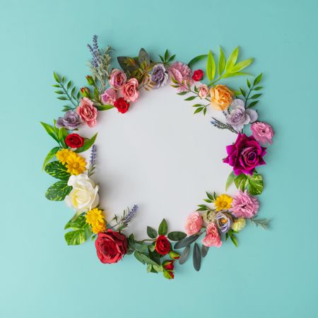 Spring wreath made of colorful flowers and leaves