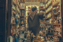 Adult seller in souvenir shop