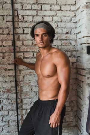 Muscular man posing in gym