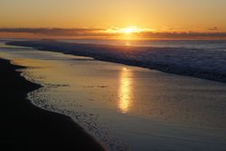 Colorful sunset over peaceful seashore