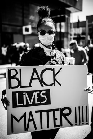 MONTREAL, QUEBEC, CANADA – June 7 2020- Woman holding a sign during a black lives matter protest