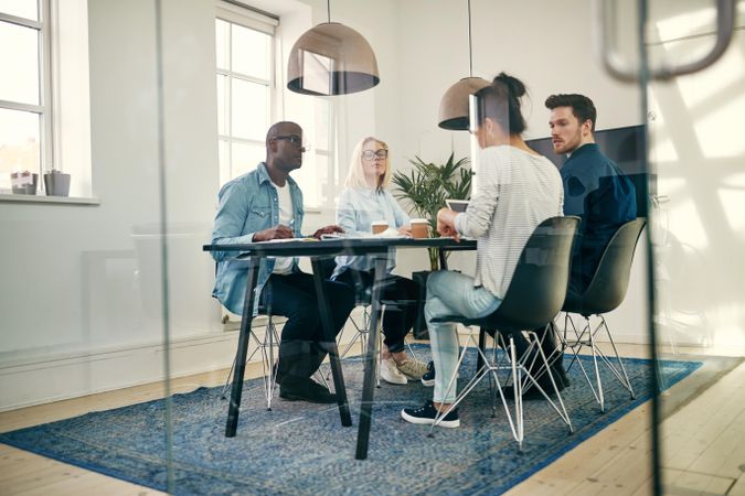 Multi-ethnic colleagues having a serious conversation in a meeting