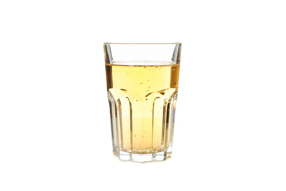 Glass of apple cider isolated on blank background