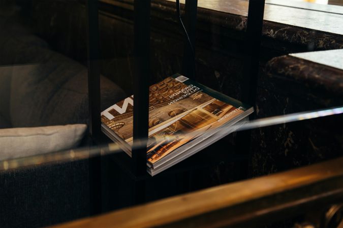 Magazine or Book on Dark Wood Table Detail