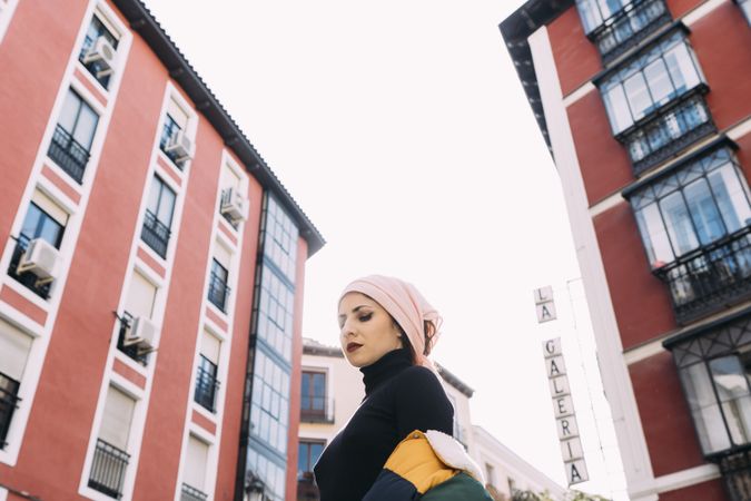 Young woman posing with cancer bandana