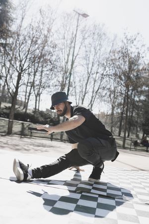 Man dancing break dance in park