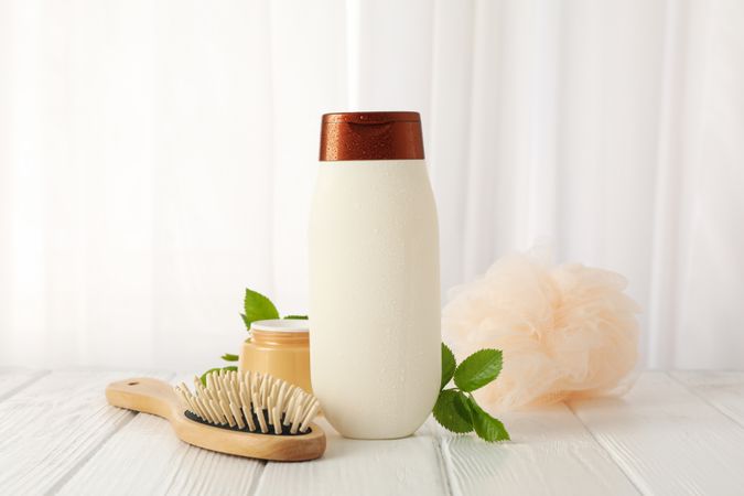 Composition with body care products on wood table
