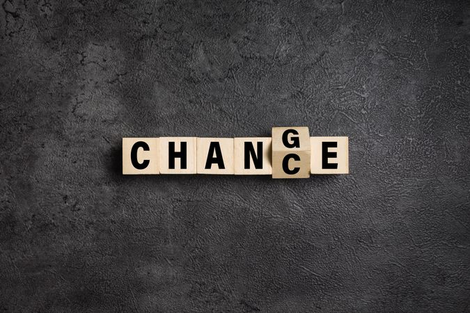 flip wooden blocks with change and chance words isolated on dark background