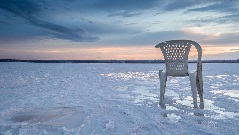 Chair on salt mine during sunset